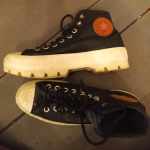 Women's size 8.5, black platform converse, with brown and pink logo.